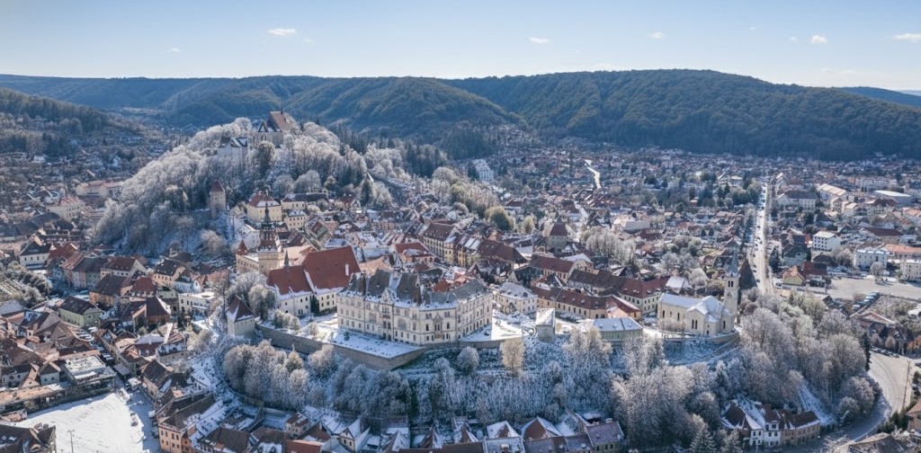 Panoramic aerial view of Sighișoara medieval citadel in Transylvania at sunset, UNESCO world heritage site and birthplace of Dracula
