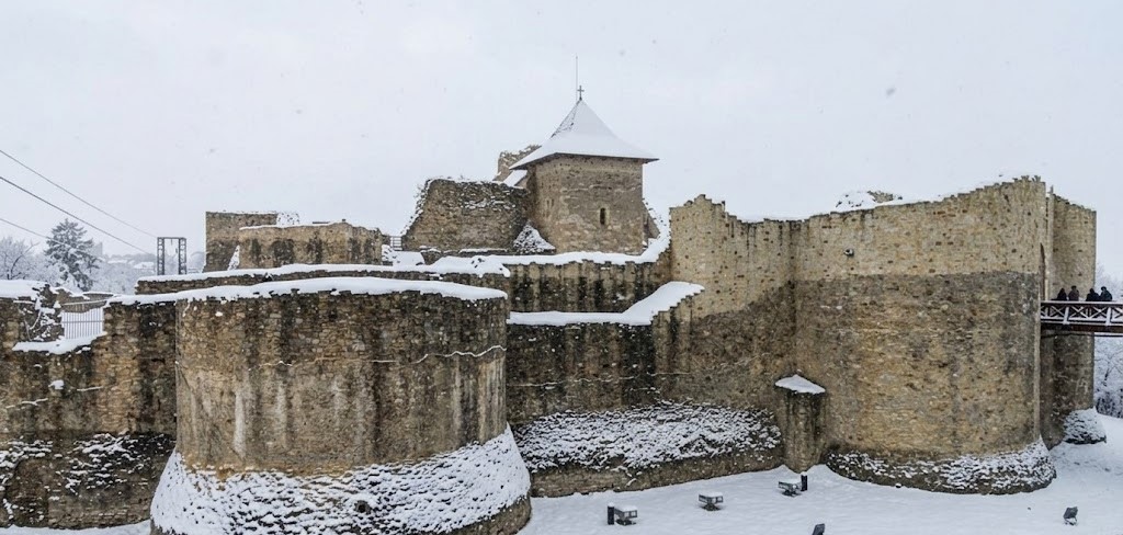 Medieval Suceava Fortress covered in a thick layer of winter snow. Medieval Suceava Fortress covered in a thick layer of winter snow.